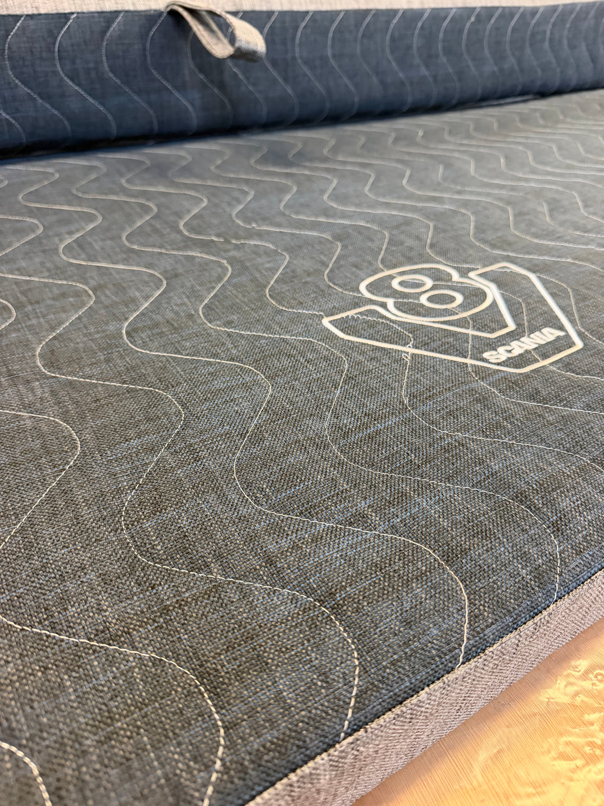Hinged Scania Next Gen truck mattress topper shown with Truck Mattress Direct’s UK-made mattress