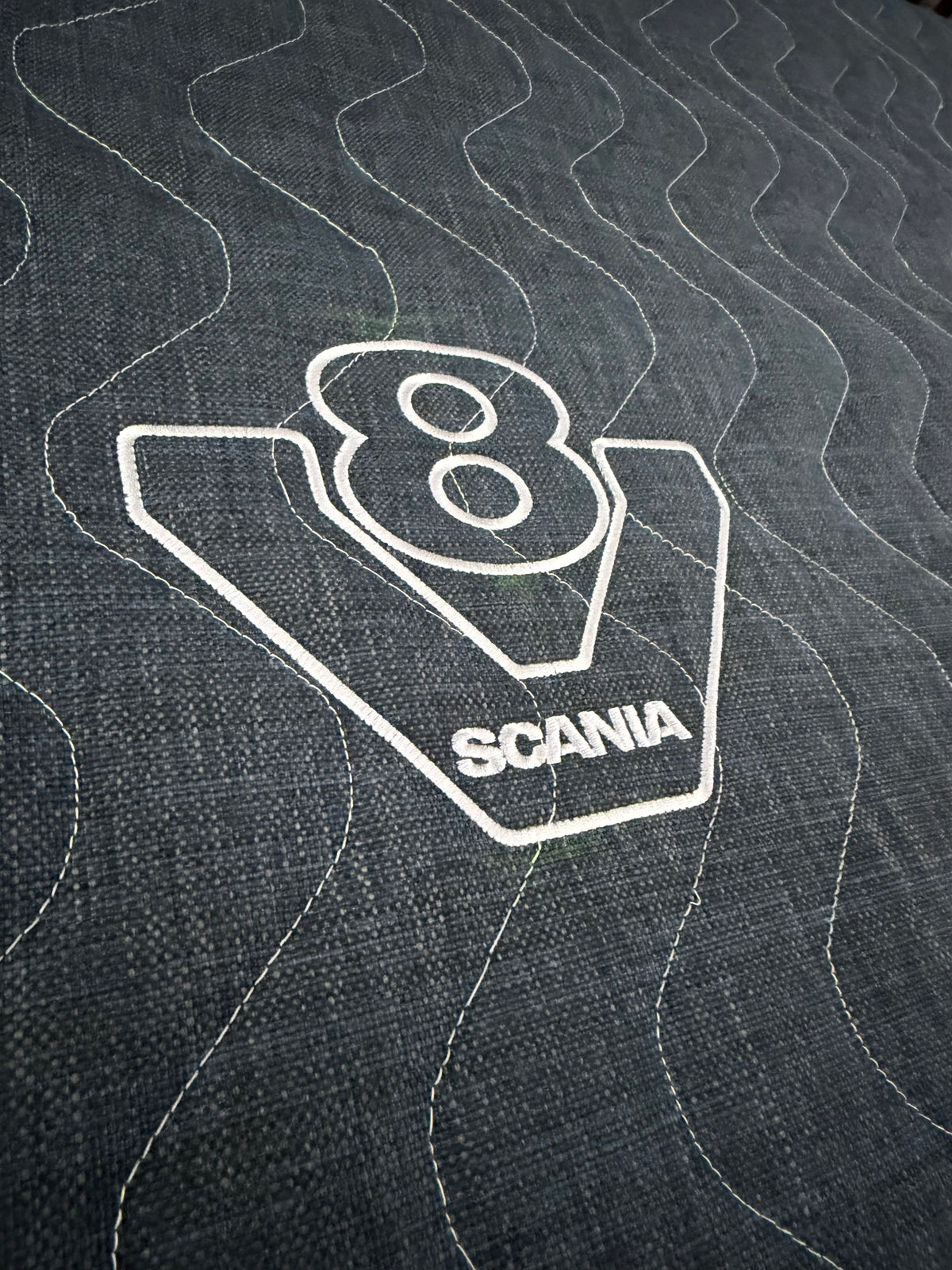 Embroidered Scania V8 logo and quilted fabric on the truck mattress topper